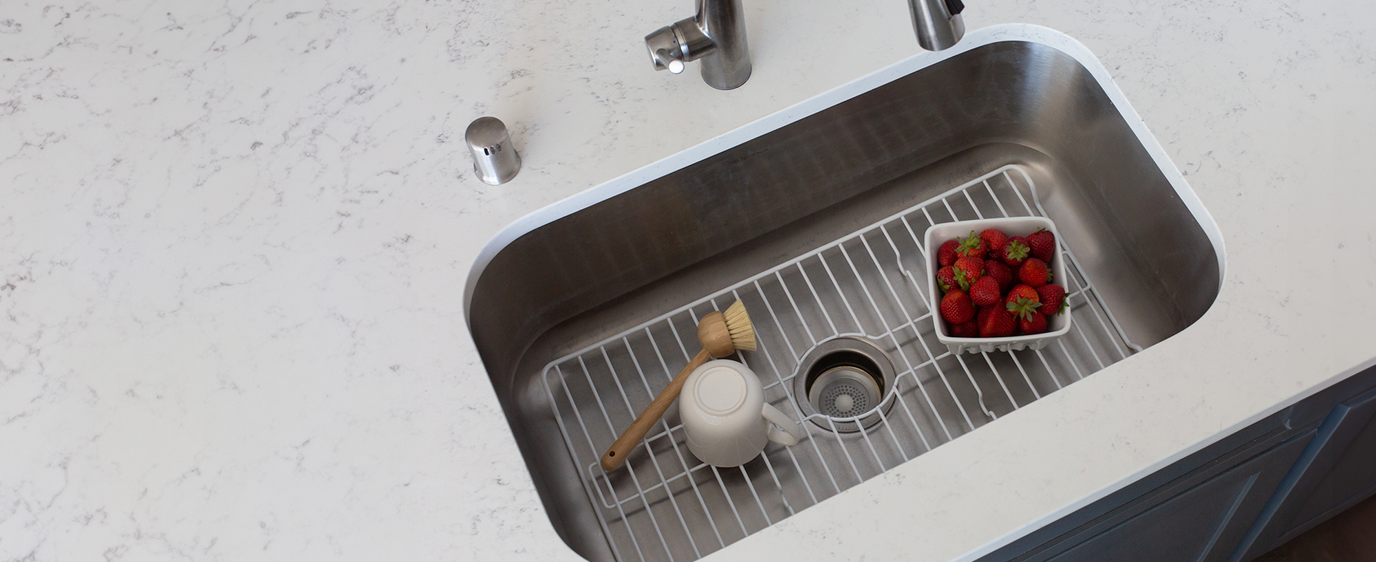 Kitchen sink organized with practical household accessories